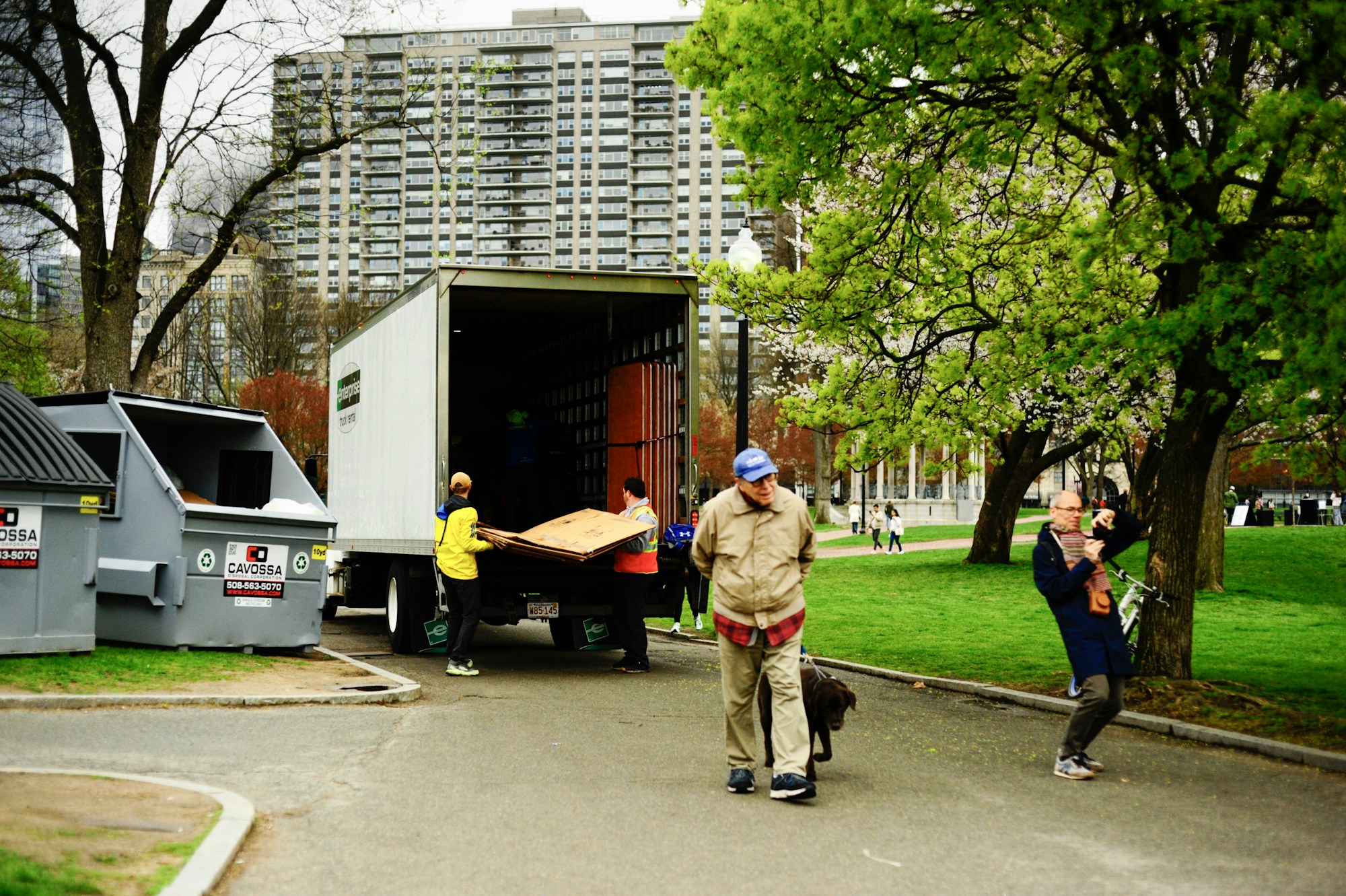 Junk removal crew loading a truck during a garage cleanout